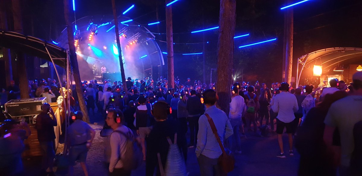 MichelKao's tweet photo. Psssssst...don't make a sound, because in the middle of Vlieland's woods there is a very silent disco happening, with @StPauldj letting all these festival lovers move and sing (quietly) here @greatwideopen's night! #gwo19 #openplek https://t.co/SVZaQunVwZ
