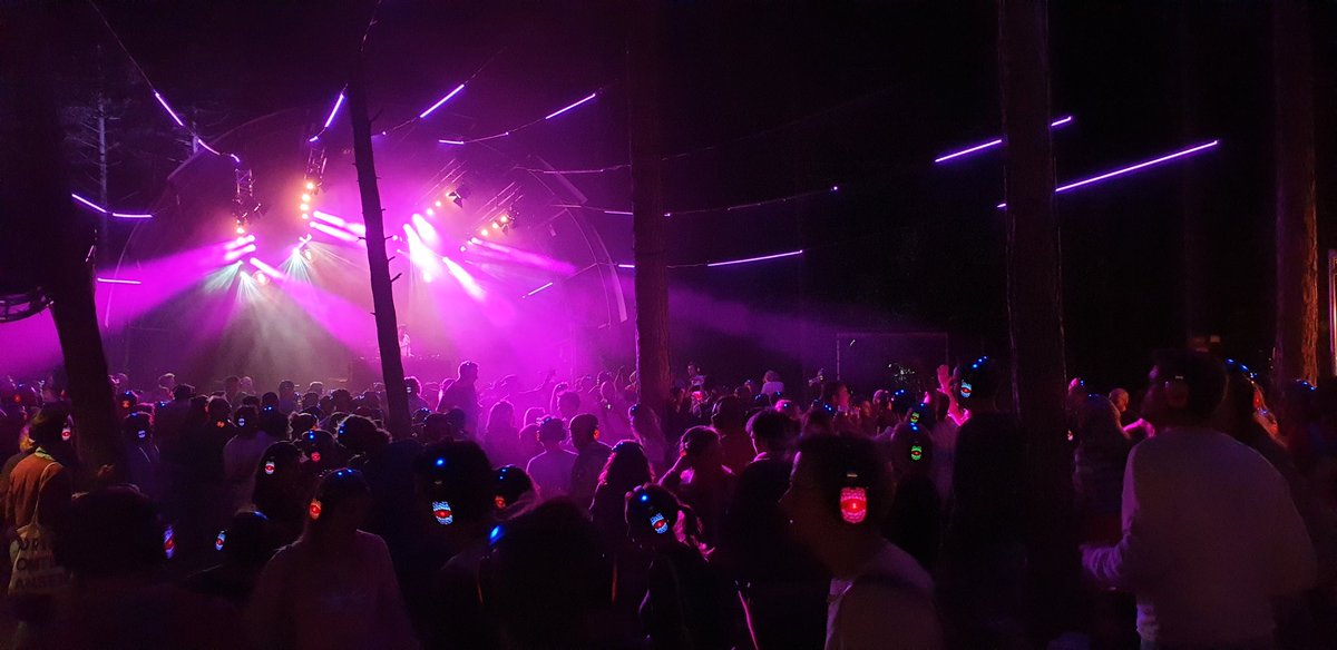 MichelKao's tweet photo. Psssssst...don't make a sound, because in the middle of Vlieland's woods there is a very silent disco happening, with @StPauldj letting all these festival lovers move and sing (quietly) here @greatwideopen's night! #gwo19 #openplek https://t.co/SVZaQunVwZ
