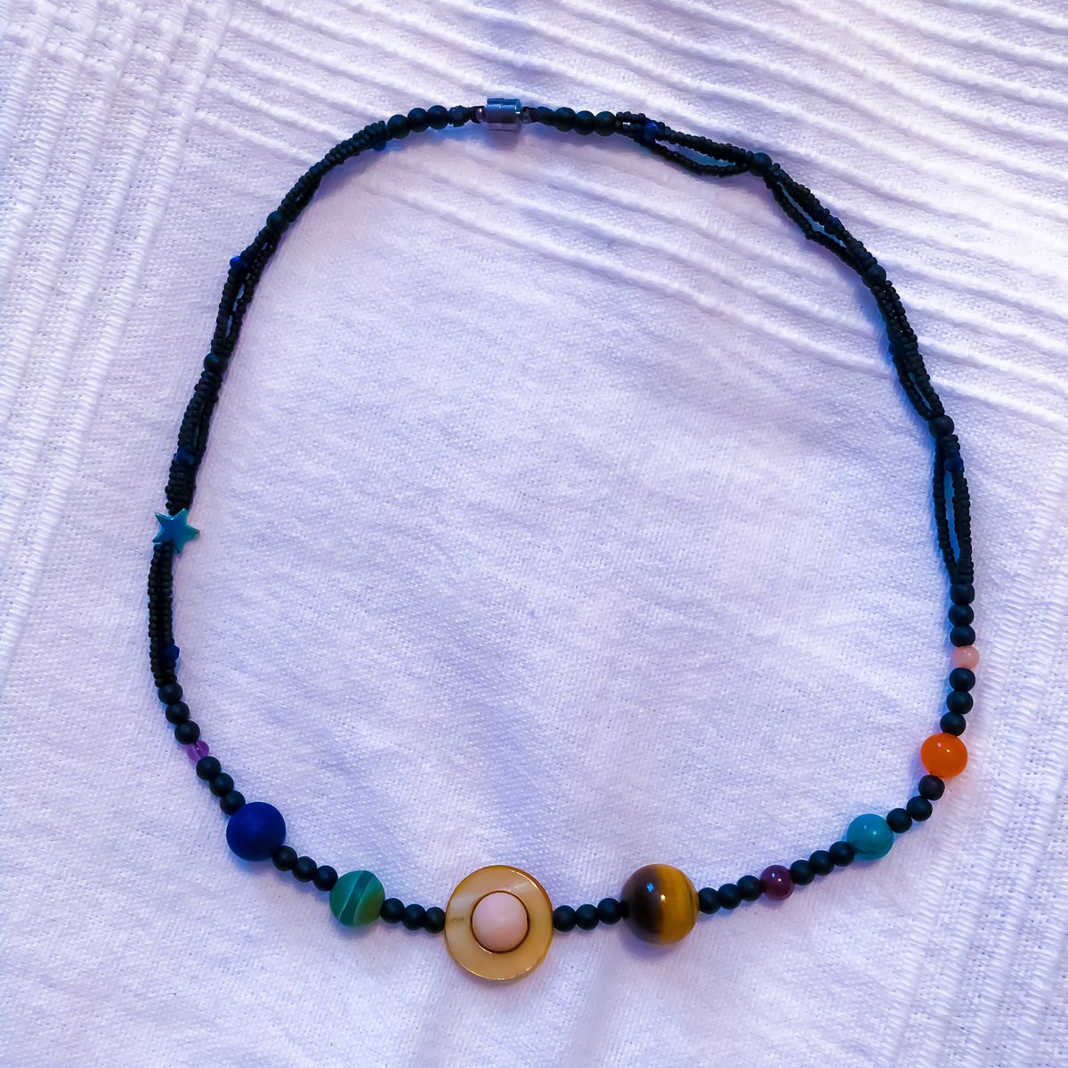 LinguaCelta's tweet photo. I made an #astronomy necklace! Yay for #academicHobbies.
#bringBackPluto https://t.co/EK4H1MzoZT