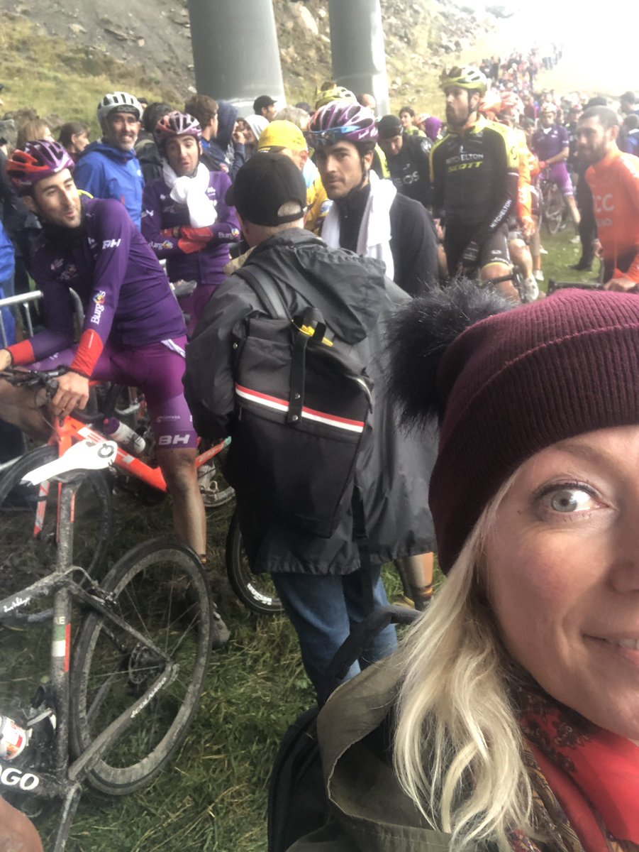 Waiting with the riders to take the lift down to the valley in Andorra. After a dramatic stage, they are wet and cold, and still have to queue to reach their buses. Great organization #LaVuelta19