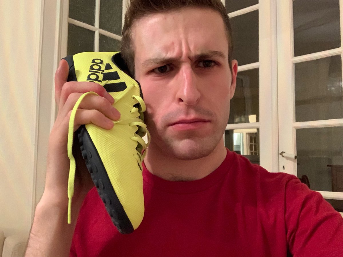 _ryanmackenzie's tweet photo. Oh hey. Why am I trying to use this fluorescent yellow shoe as a phone, you ask? Here’s a little story about #unwantedfringebenefits... (1/6) https://t.co/5Vi9aHtrsd
