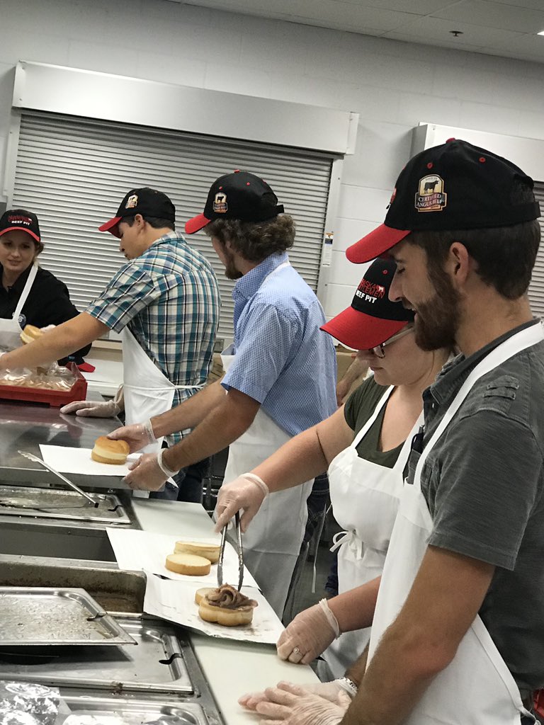 scc_ag's tweet photo. SCC Ag Students preparing sandwiches at the Nebraska State Fair for the @necattleclassic #beefpit. @scc_ag @SCCNeb https://t.co/fjigqE2M3L