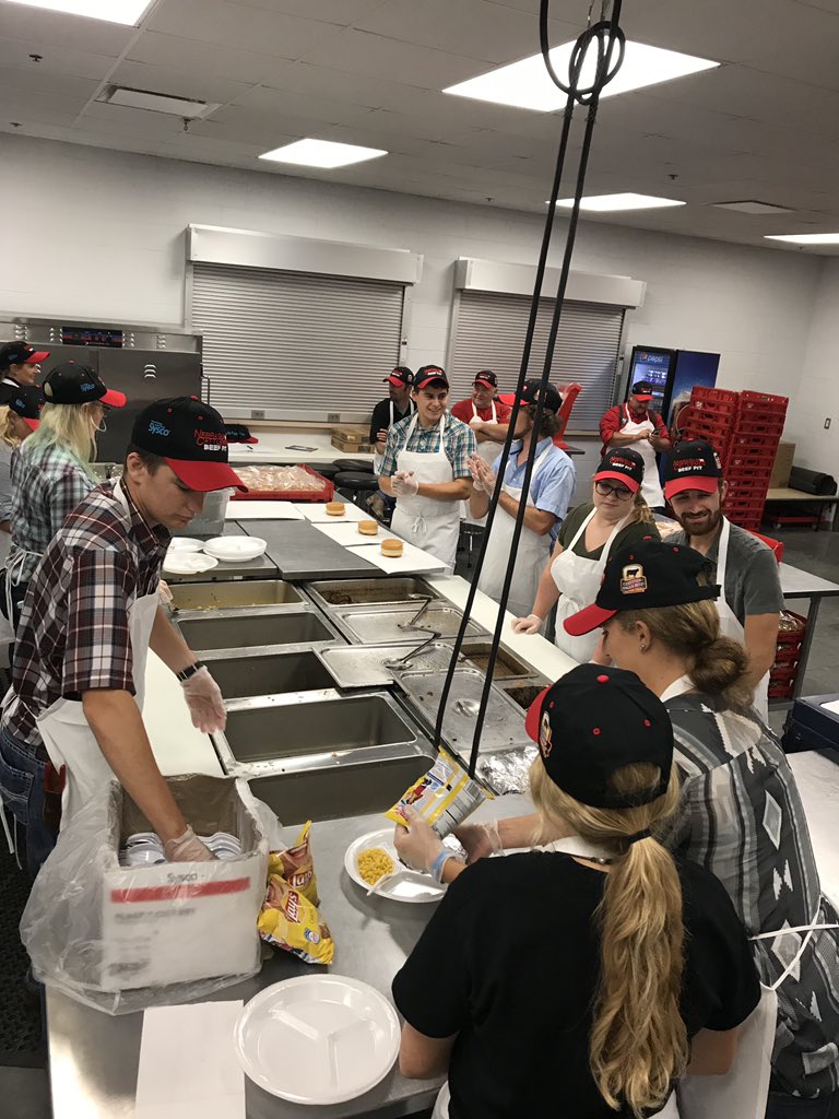 scc_ag's tweet photo. SCC Ag Students preparing sandwiches at the Nebraska State Fair for the @necattleclassic #beefpit. @scc_ag @SCCNeb https://t.co/fjigqE2M3L