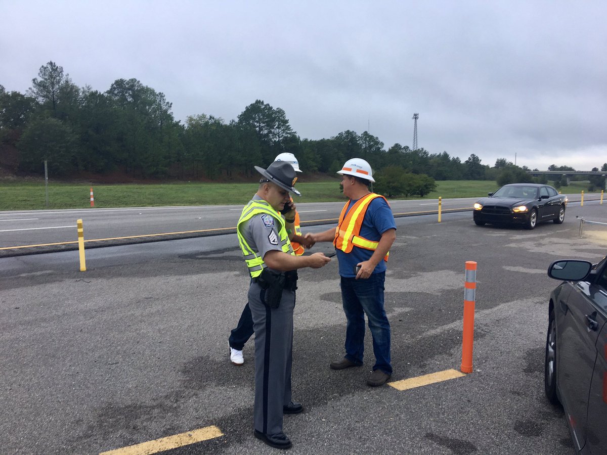 SCDOTPress's tweet photo. Happening Now: Employees with SCDOT and Troopers with the SCHP are preparing to reverse lanes on I-26. Gov. Henry McMaster has ordered mandatory evacuation for coastal counties. Evacuations will begin today at noon. https://t.co/NJJifI7LB8