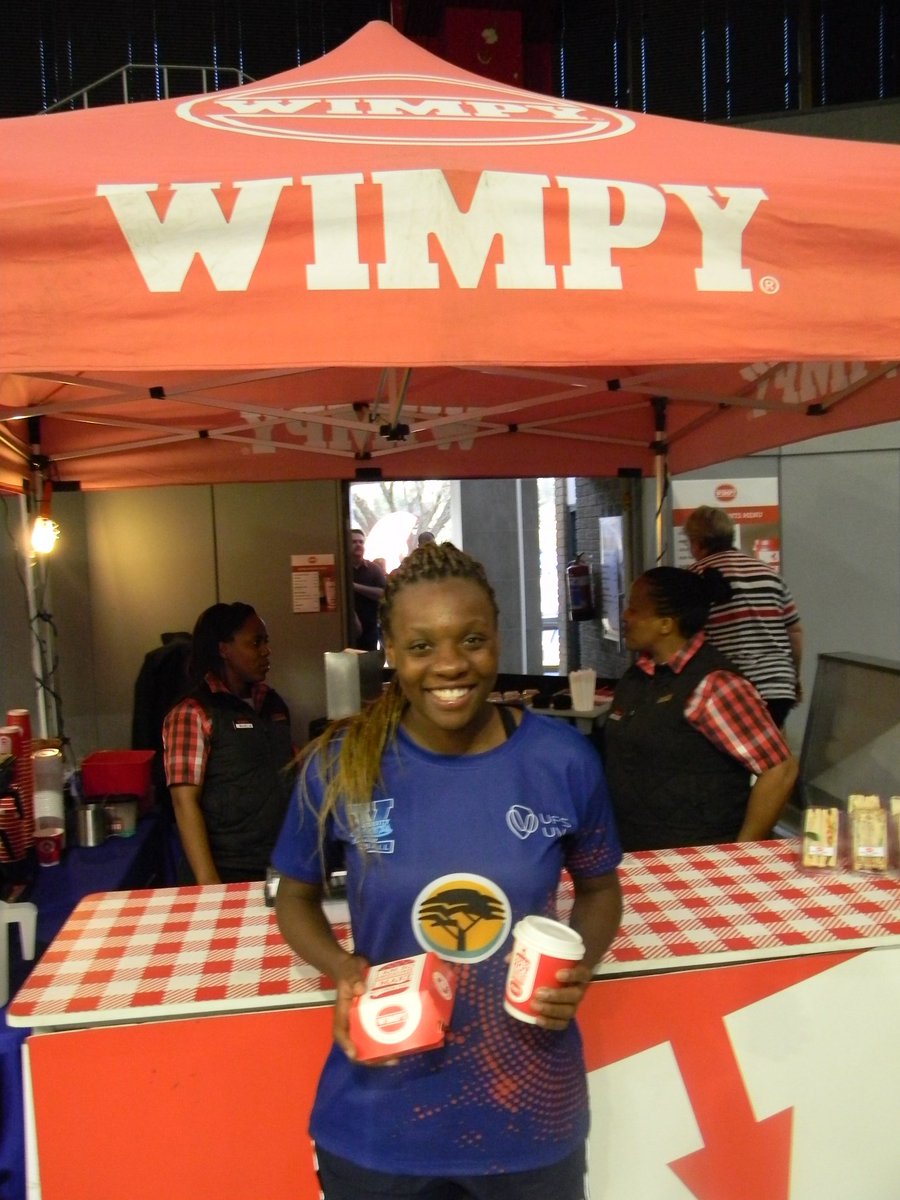 wimpy_sa's tweet photo. Khanyisa Chawane is the player to watch at Varsity Netball. Having won Player of the Tournament in 2018, she has since been selected for South Africa’s national women’s side. Best of all? Even on game days she finds time to enjoy a Wimpy moment. https://t.co/Dz05We8oU9