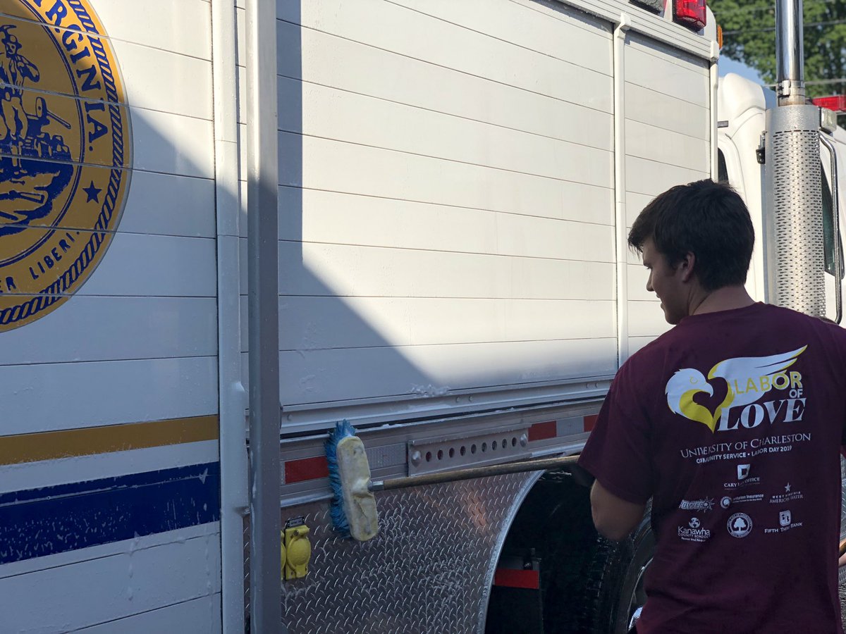 fxithann's tweet photo. #UClaborday washing fire trucks for labor of love. UC is always giving back to the community! https://t.co/eZpSDkAkQD