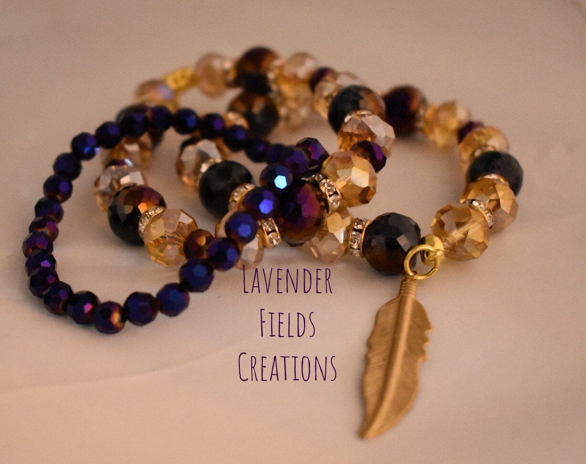 Excited to share the latest addition to my #etsy shop: Purple &Gold Triple Stack Glass Bracelet with Brass Feather (201945B) etsy.me/2zHlKc7 #jewelry #bracelet #purple #gold #women #glass #feather #stretchjewelry #stackjewelry #smallbusiness #lfieldscreations