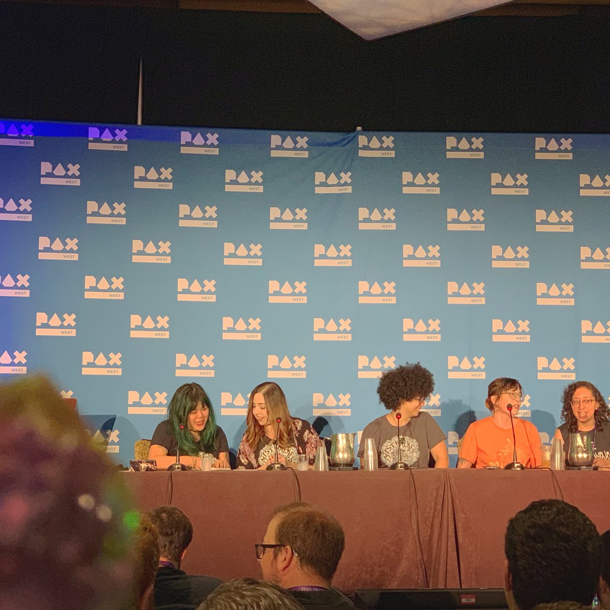 Everyone at a table on stage