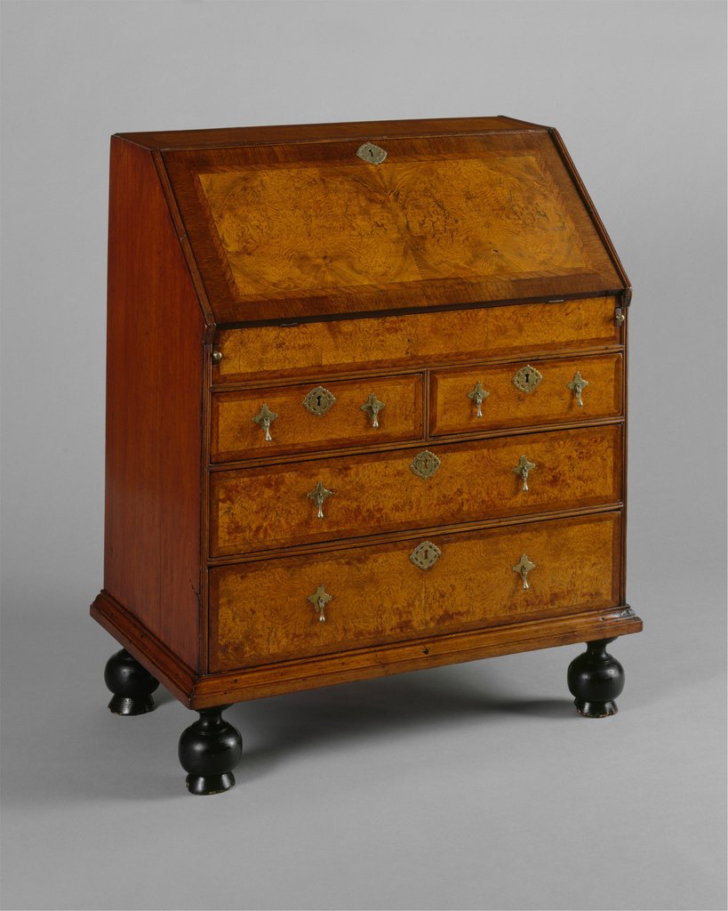 AntiquesMag's tweet photo. Fall-front desk, Boston, c. 1700-30, with walnut burl veneer. This form combines existing typologies of a chest of drawers and portable desk. This was given to @metmuseum by Ms. Olivia Sage in 1909, part of a 600 object gift that would become the #metamericanwing #antiqueoftheday https://t.co/aLtIdOCU4Z