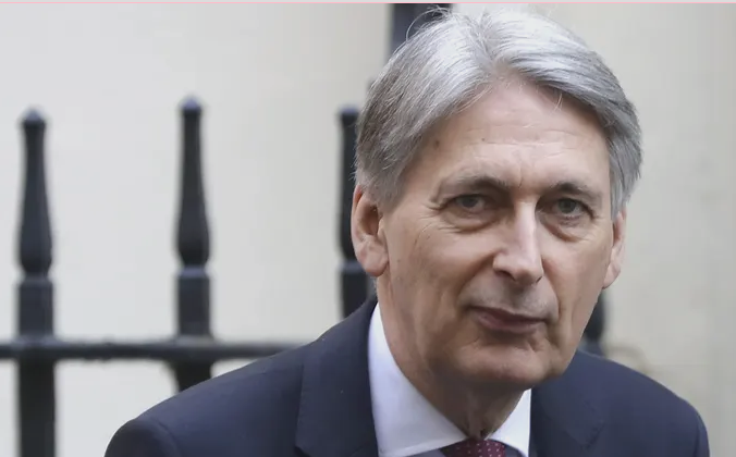 themattmoore's tweet photo. Is this Phillip Hammond…. or Theresa May in drag? https://t.co/Q1unuBAuKN