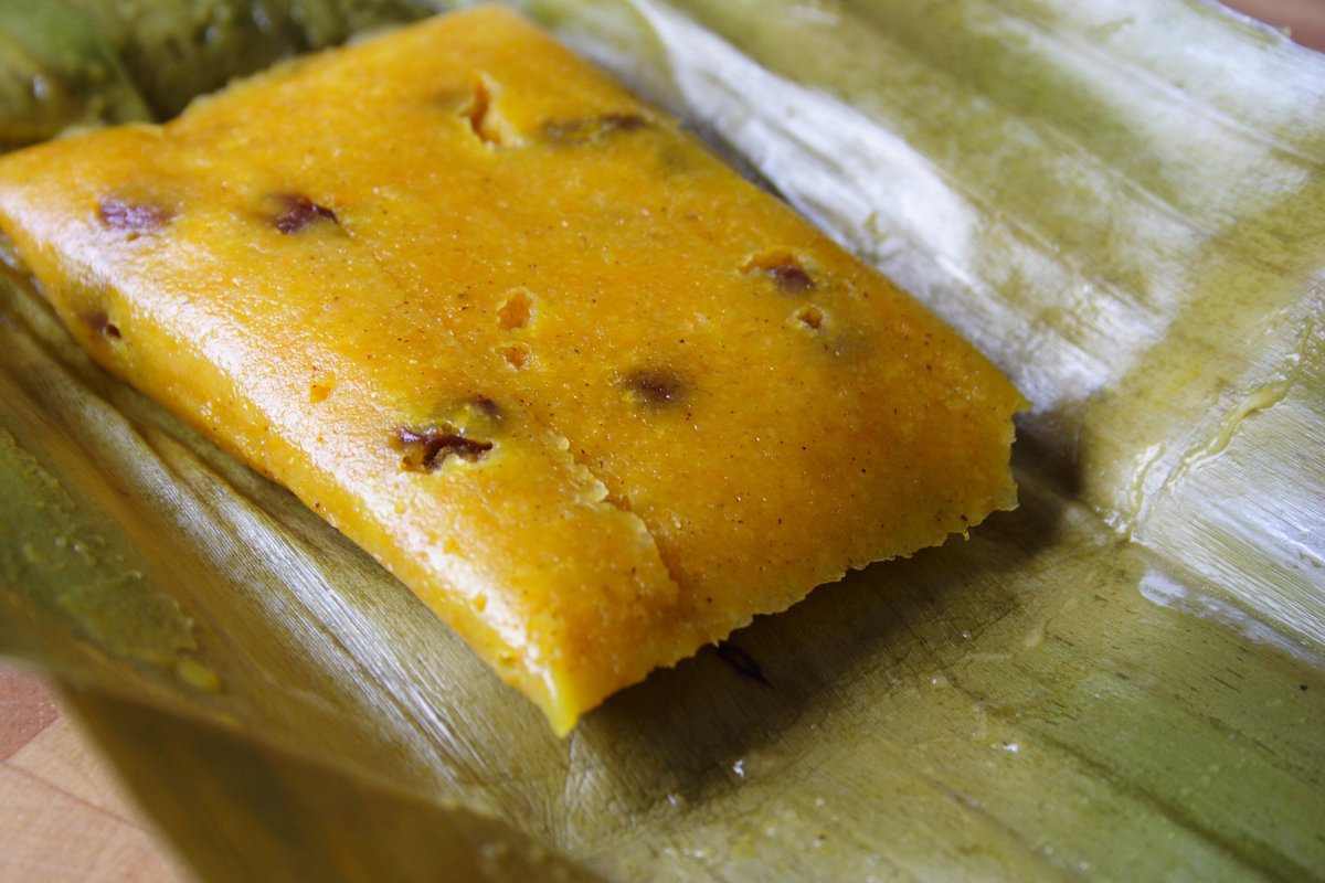 CDreamsPublish's tweet photo. It's not too early to talk about Conkies🤤, is it? 

#Conkies are a sweet #Bajan delight made with grated coconut🥥, sweet potato🍠, pumpkin and sometimes raisins, steamed in banana leaves🍃.

How do you like your conkies? #Raisins #NoRaisins https://t.co/2gg8Umi4T6