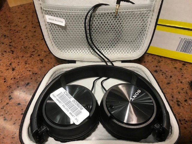 this photo shows noise cancelling headphones in a case