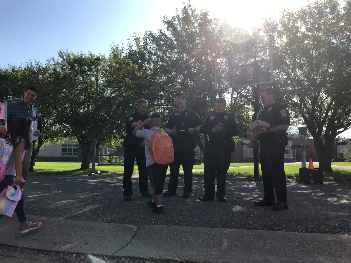 HopkinsPolice's tweet photo. Happy First Day of School Everyone!   We started it off right this morning by giving out pencils to students at @AliceSmith270 and @Ike_XinXing270  GO HOPKINS! @Hopkins270 https://t.co/ysbNDs40Lf