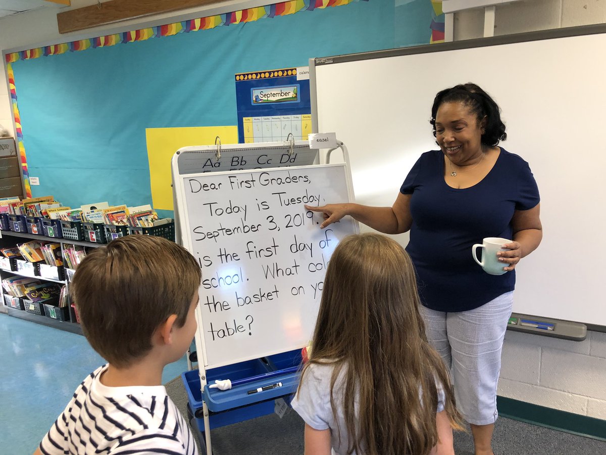 lsullivan's tweet photo. Ms Vaughn @KwbVaughn welcomes 1st grade students on the first day of school &amp; then Ss greet classmates as they enter the classroom #community #KWBPride @BarrettAPS #APSback2school #APSisAwesome https://t.co/twODiz0bGP