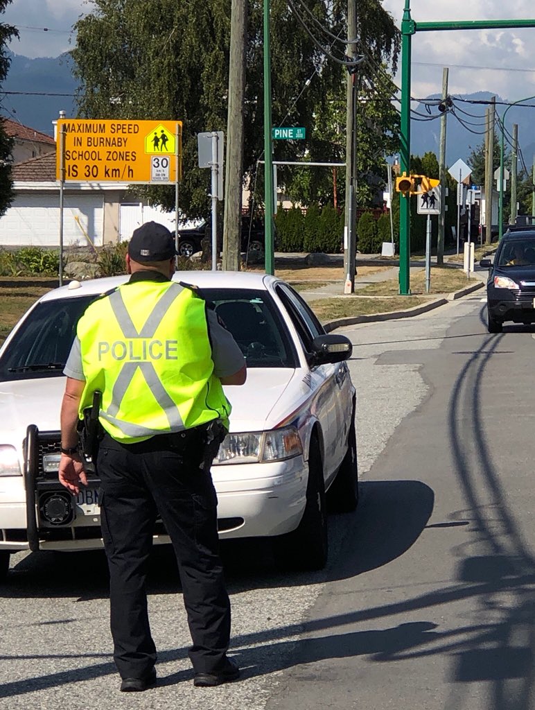BurnabyRCMP's tweet photo. Expect more 🚗 traffic in and around school zones 🚸 on your afternoon commute - please be patient, give way to school buses 🚌 and keep your speed 🏎 to 30 km/h. @BurnabyRCMP 🚔 are in school zones across @CityofBurnaby making sure everyone is staying safe! https://t.co/Chg3WEM9nR