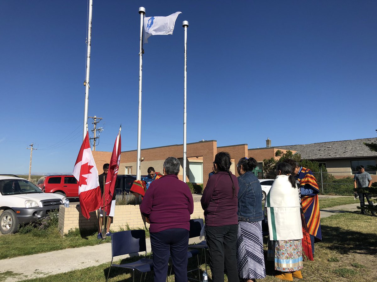 Tawnya_PE's tweet photo. Piikani Nation Secondary School and Napi’s Playground Elementary school welcomed back students with a blessing, raising of the flags to kick off the new school year. https://t.co/C5ULsEr2et