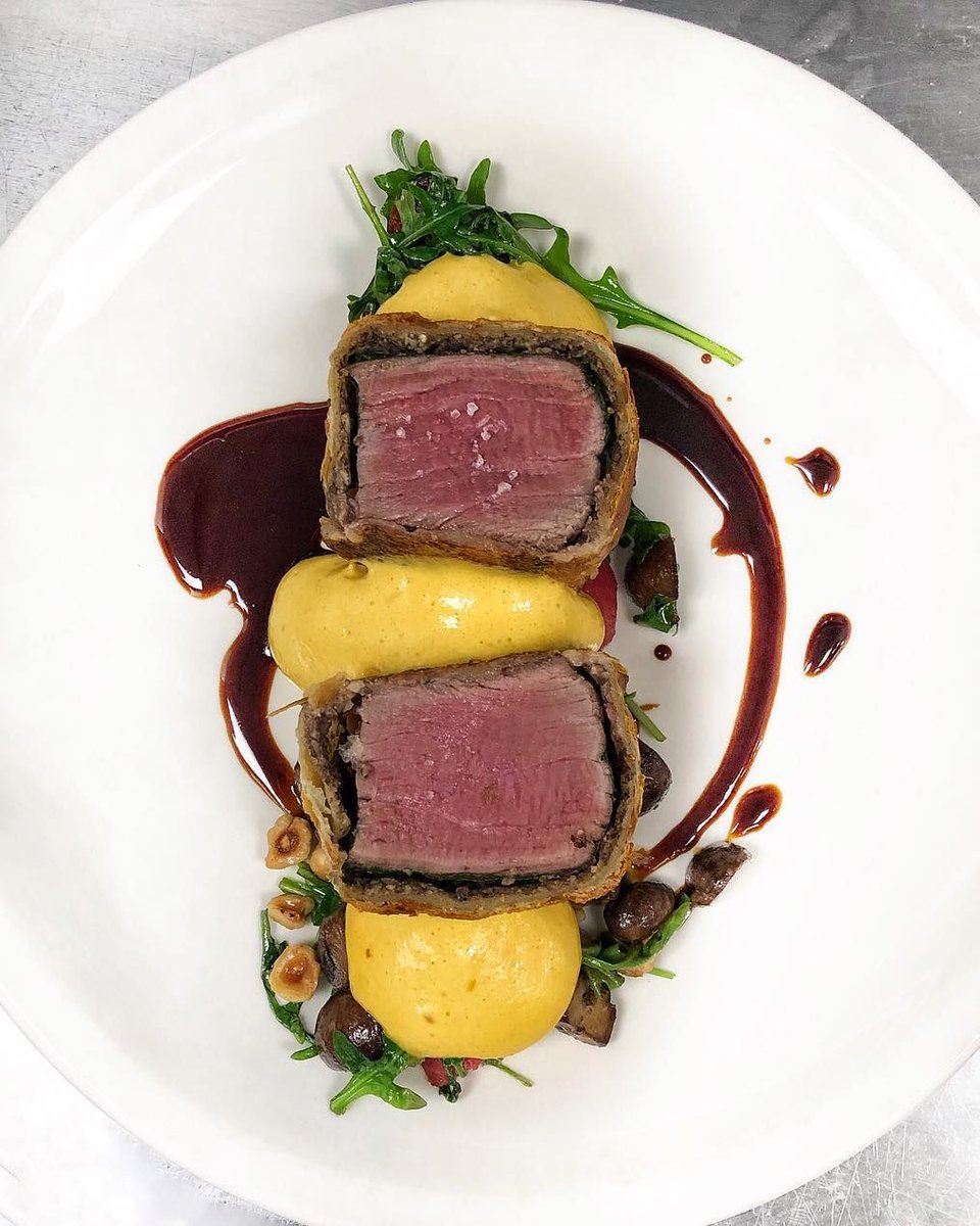 eat10acres's tweet photo. Our BEEF ON CROUTE might be better than grandma's. Ethically-raised beef tenderloin filet, mushroom filling, golden brown puff pastry, red wine sauce, toasted hazelnuts and potato puree. Available in the Kitchen for dinner. See the full menu > https://t.co/VdgrCHOdub 
#Eat10Acres https://t.co/ingSLWt8o2