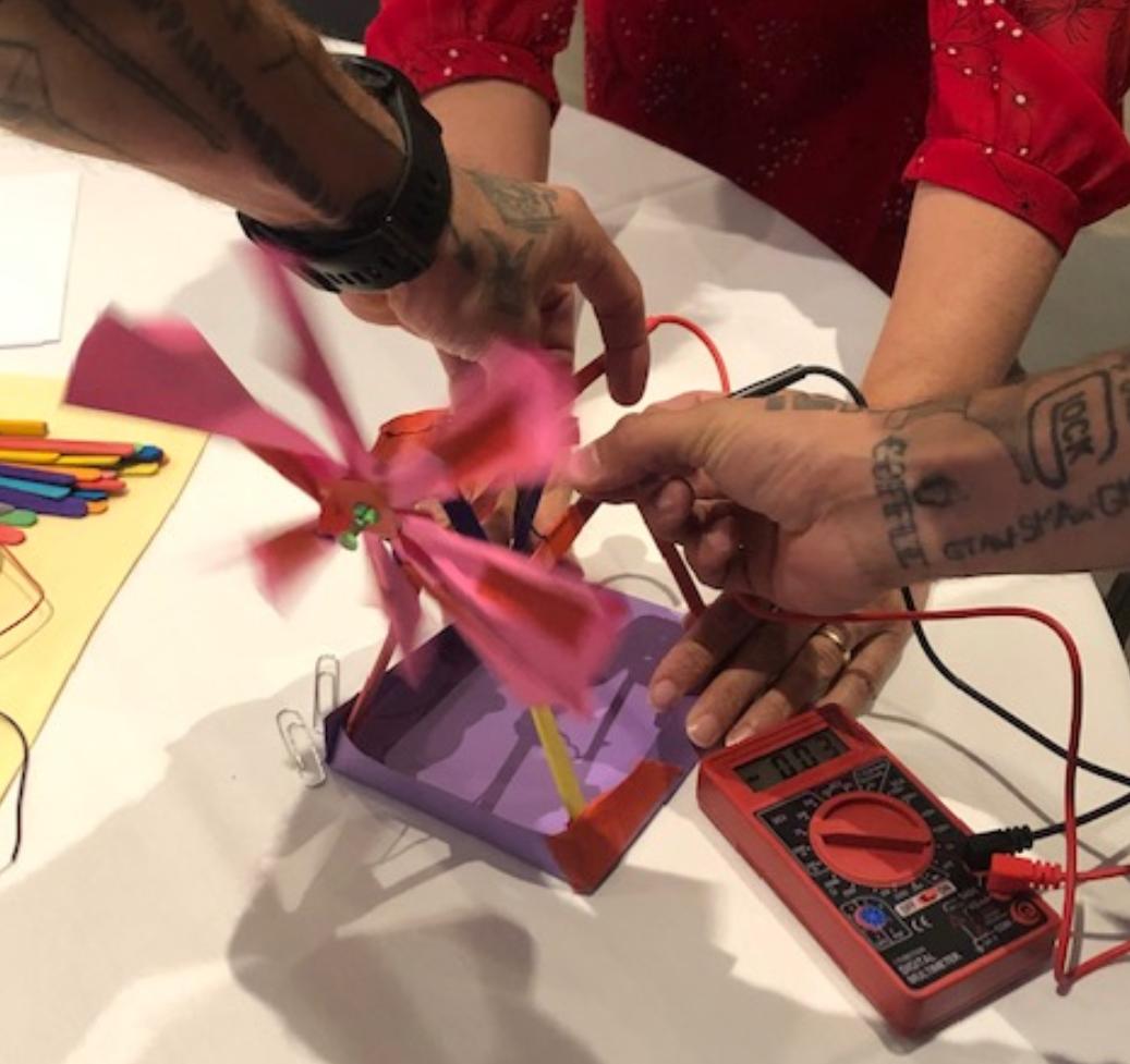 mdispezio's tweet photo. Teachers plan, construct, and optimize an electricity generating model of a #wind_turbine as part of a workshop on #energy_transformation and #engineering design solutions for #global_issues. Assortment of blade and housing designs. Very #NGSS  @LeadAndLearn #HMHScience https://t.co/nFUqGT2Rt4