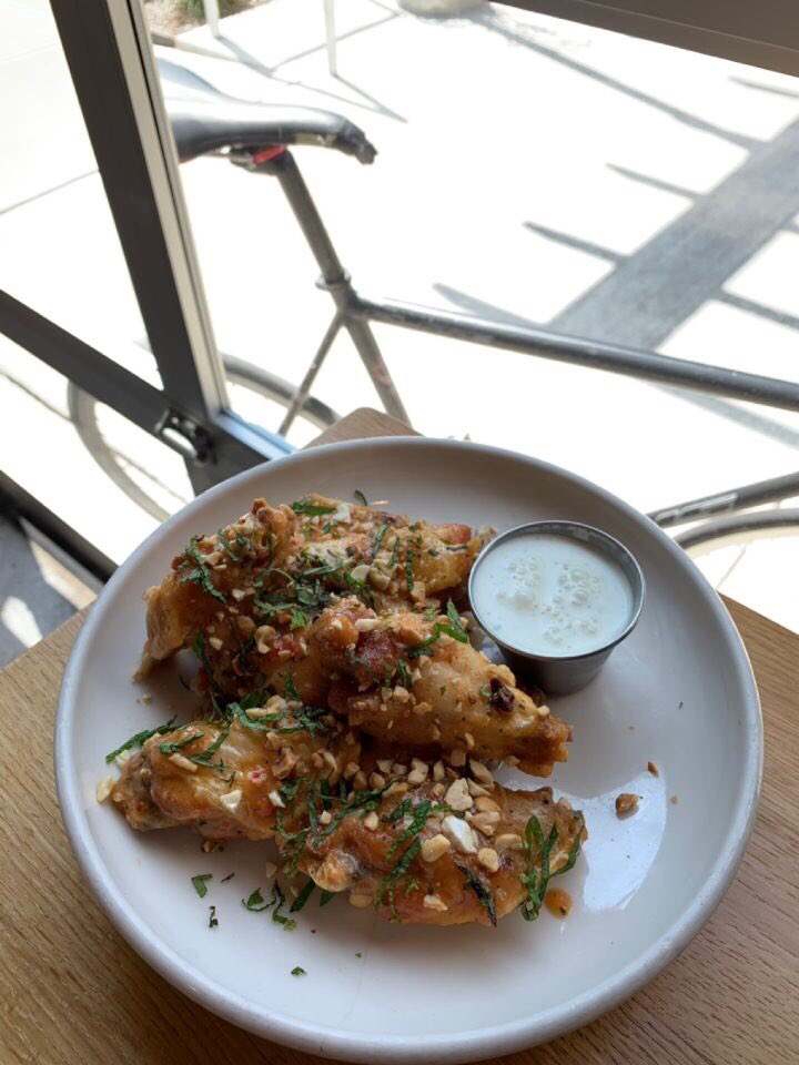 Peach reaper wing special.  Ghost reaper pepper, charred peaches, finished with hazelnut cashew and mint, order with side of ranch/blue cheese. #kingdough #kingdoughindy