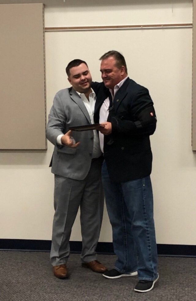 2019 Class 6 student Micheal Martin Jr. receives his DTS certificate from his father Michael Martin..(DTS Grad 1994)