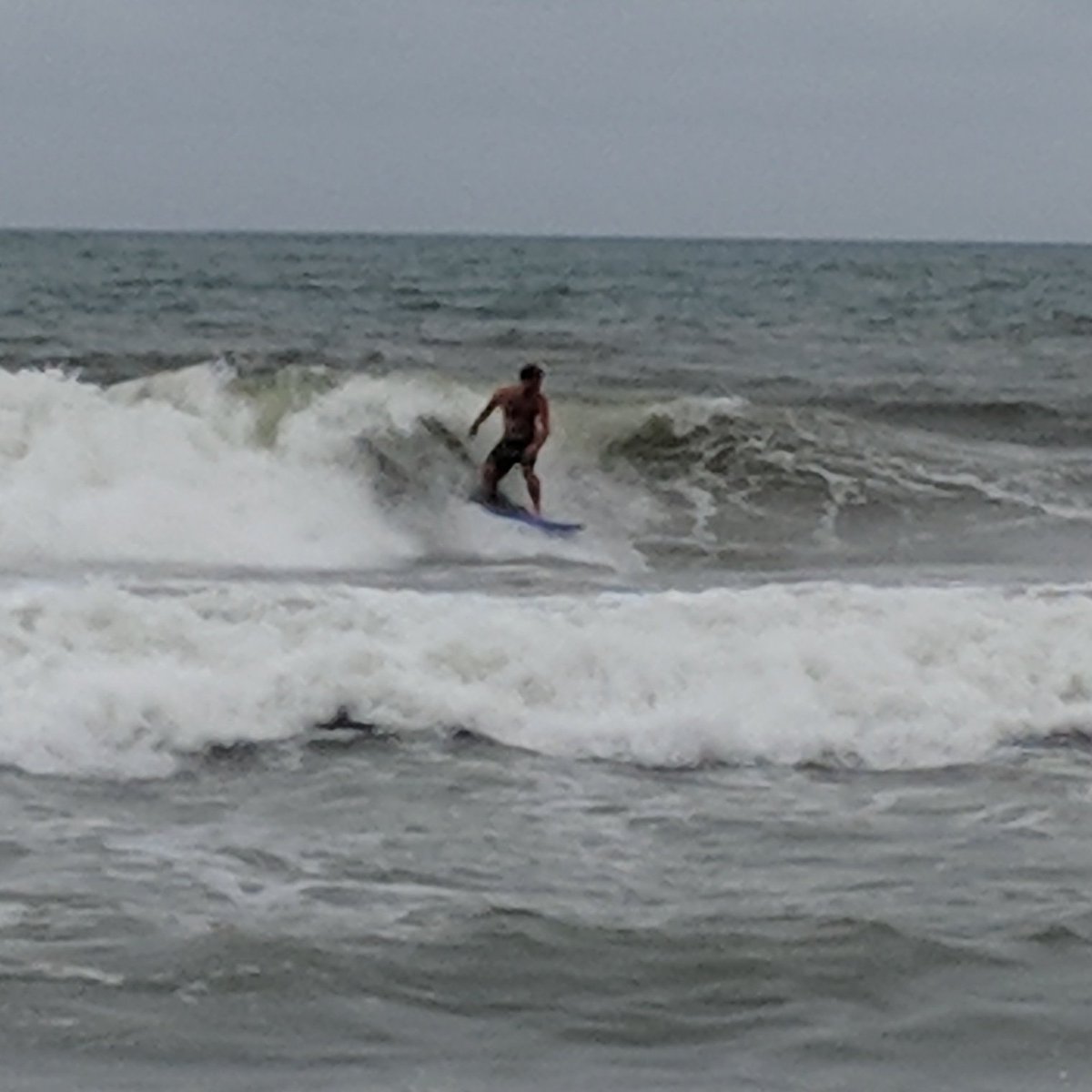BooksToBeRed's tweet photo. This is what some O'cockers do after an afternoon of hurricane prep. What a way to end the day than by catching a few Dorian waves. #ocracoke #surfing #HurricaneDorian #ridethewind #obx #notevacuating https://t.co/bN1u4f5ubL