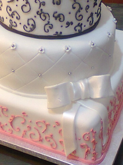 White icing... I Love how it looks when it has a pearlescent effect applied,  the bow is shimmering and you can see the contrast between with the white tier...
#Cake #wedding #Vanilla #Love #Bake #WeddinngSeason #BrideToBe #GTBI #Handmade