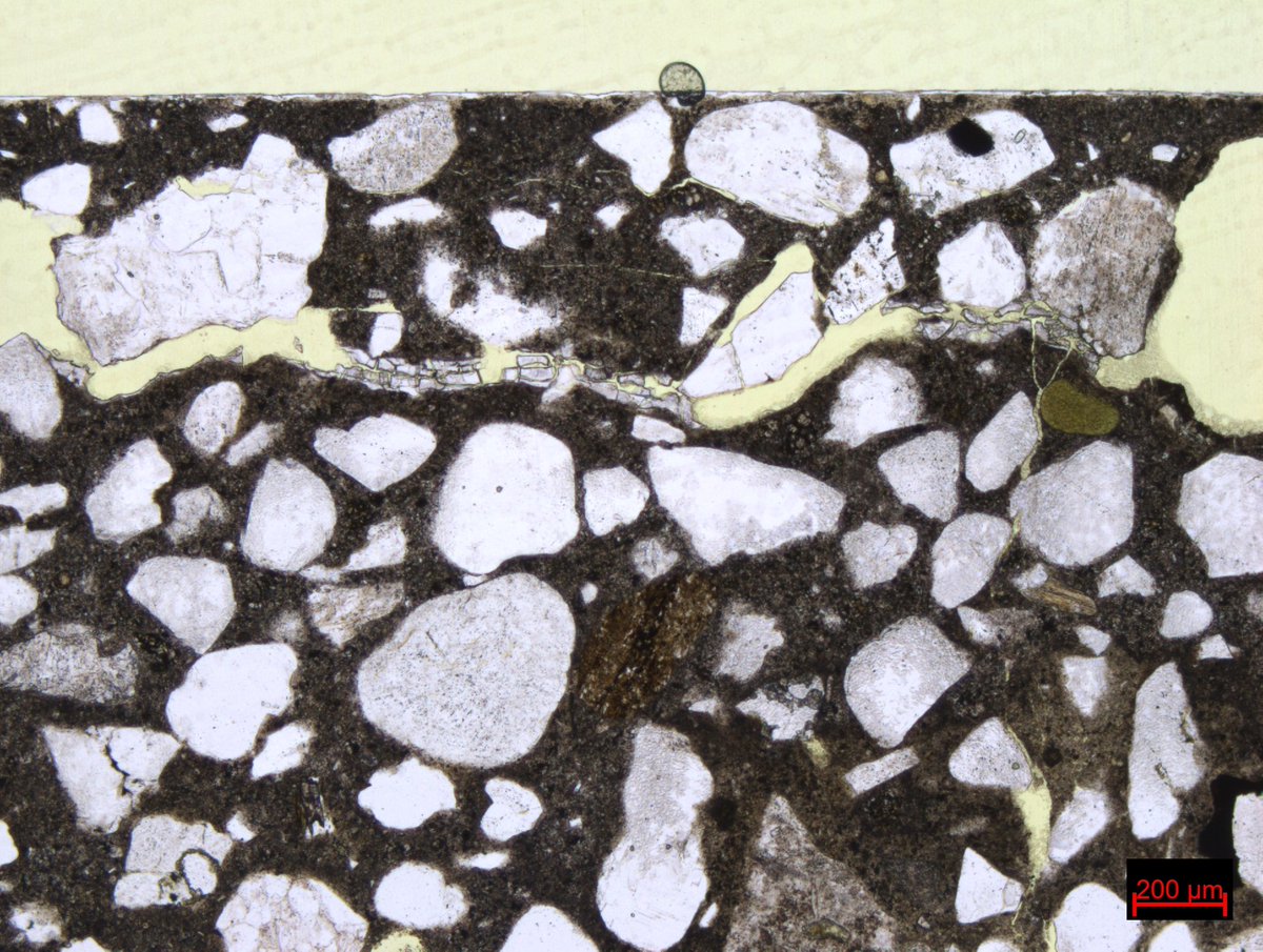 RSKPetrography's tweet photo. Alkali-silica reaction is one of the things we look for in concrete samples. This one was clearly suffering, with ASR gel in the cracks and voids. #ThinSectionThursday https://t.co/MNgcyCl7UZ