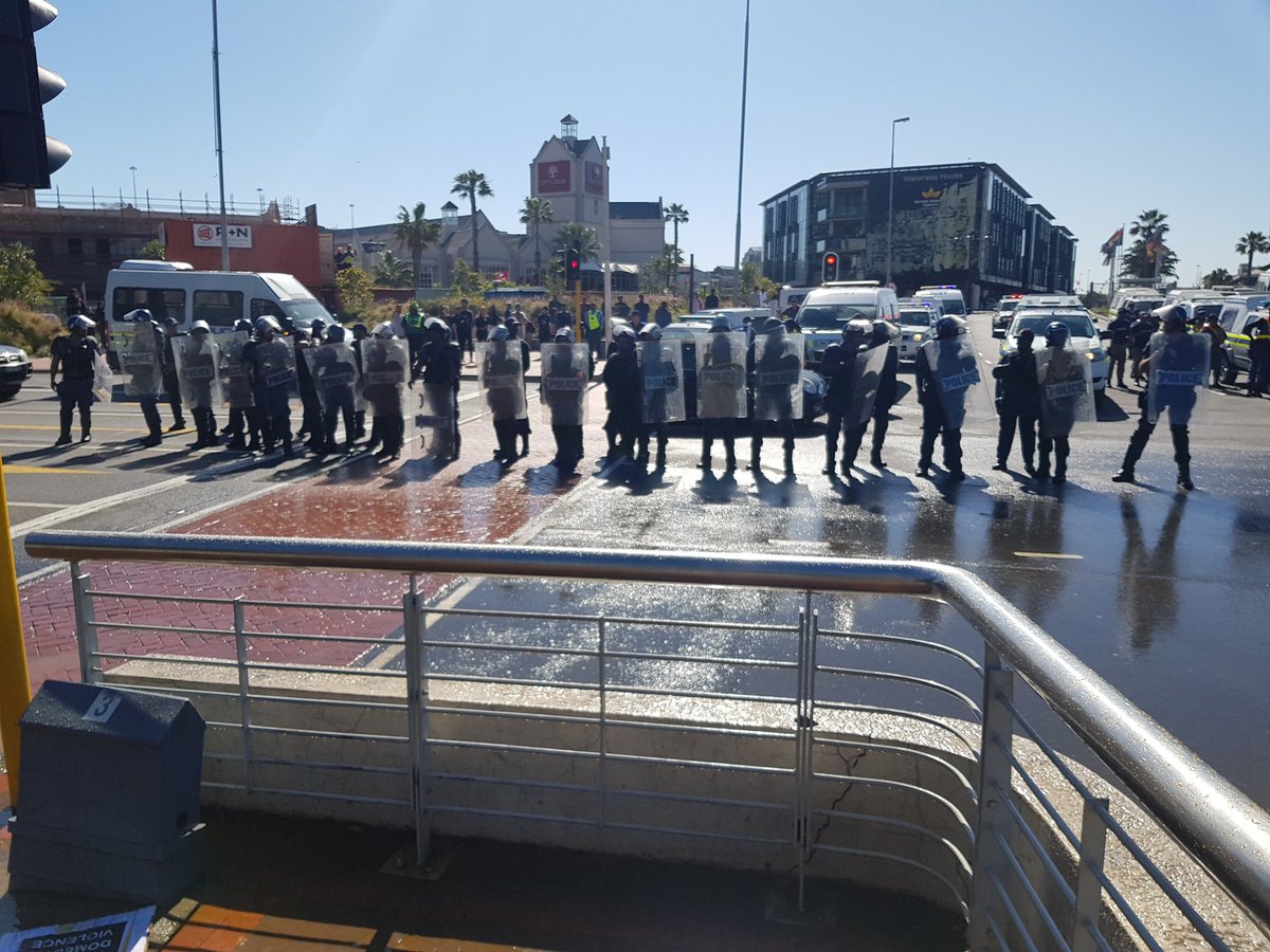 simonallison's tweet image. I'm at the #AmINext protest in Cape Town. The police just sprayed themselves with their own water cannon. Golden rule: don't piss into the wind.