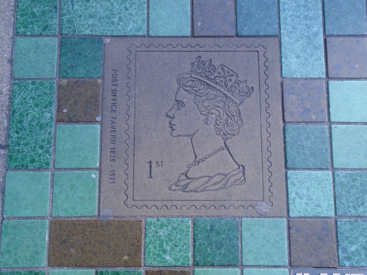 laurapmmr's tweet photo. I reckon postcrossers and philatelists might like this plaque I spotted on the pavement on a street in Norwich #postcrossing #snailmail #philately #BritishPubNames #Stamps https://t.co/DjNjybUDuQ