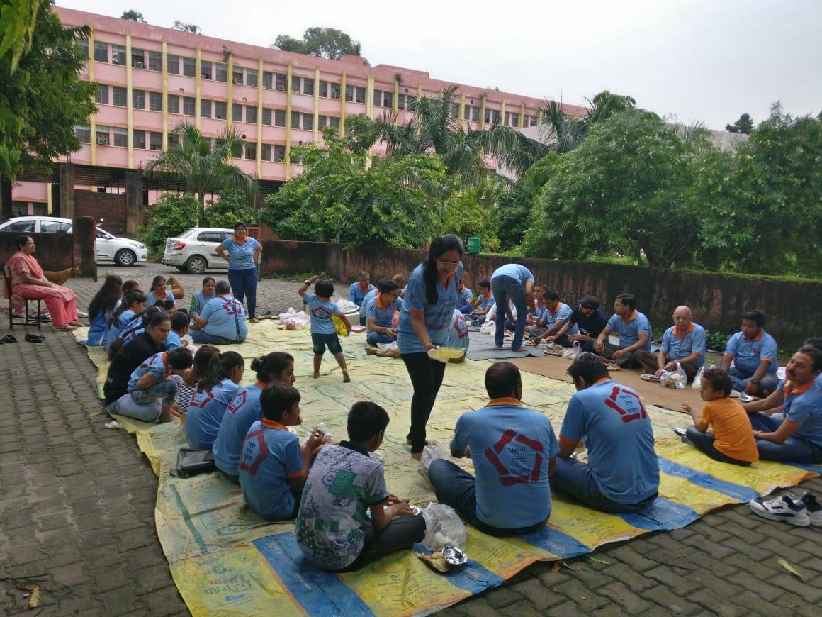 We are against discrimination based on caste, creed and colour. We do sahbhoj once a month in which we ask our volunteers to bring vegetarian food from their kitchens and eat together sharing each other's food sitting on the ground.