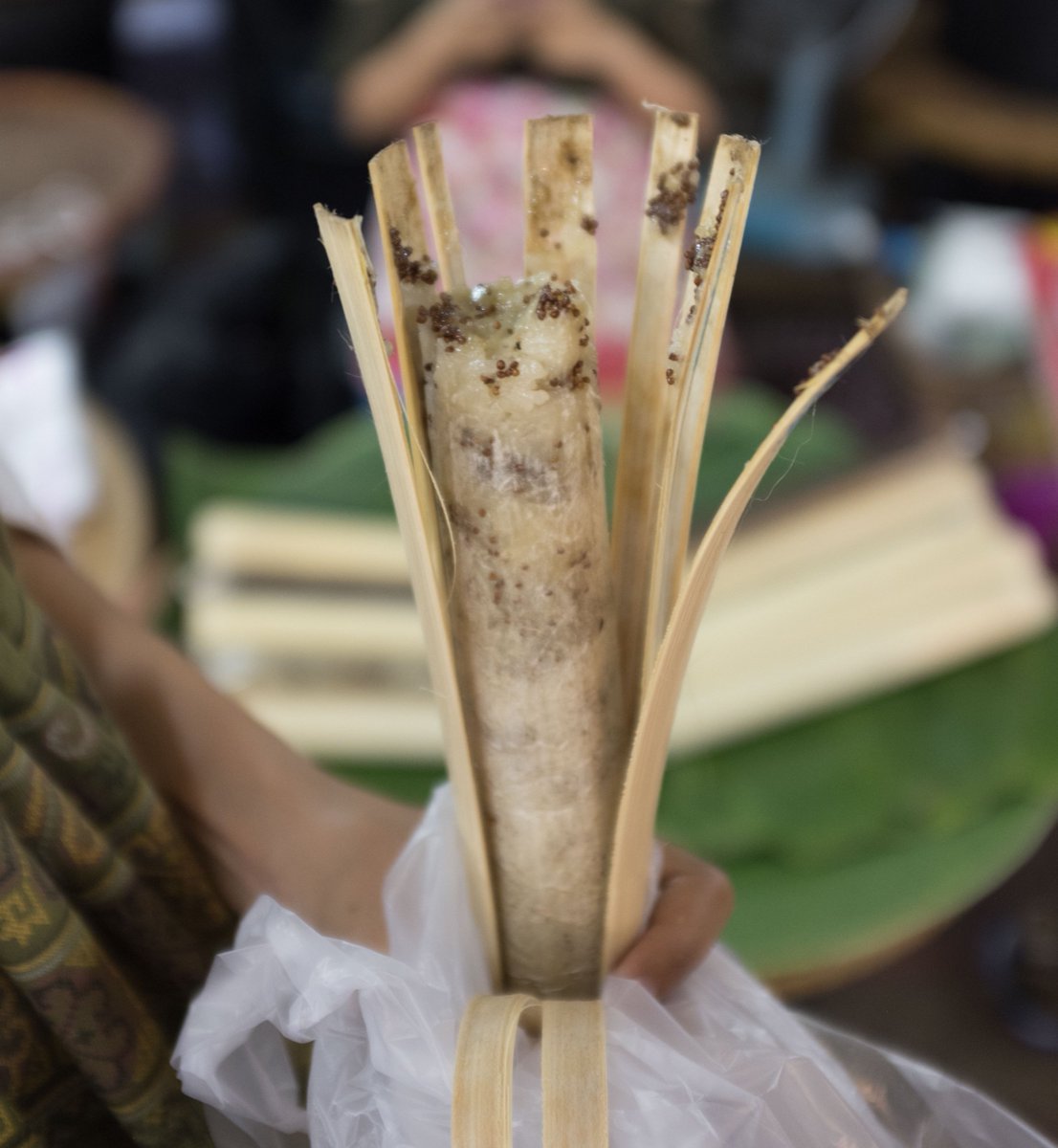 I love Thai Sticky rice, but this is next level!  Many market and street vendors offer variations of sticky rice packed into bamboo and then either roasted over charcoal or steamed. It's a very convenient snack to grab on the go.  Any guesses on what kind of seed is in here?