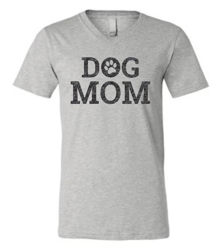 Due to #populardemand here is our bestseller #dogmom design on a grey v neck shirt! We will be at #wagsandwaves #garland #hawaiianfalls this weekend with our #newestthreads #chowandtabby #dogmomshirt