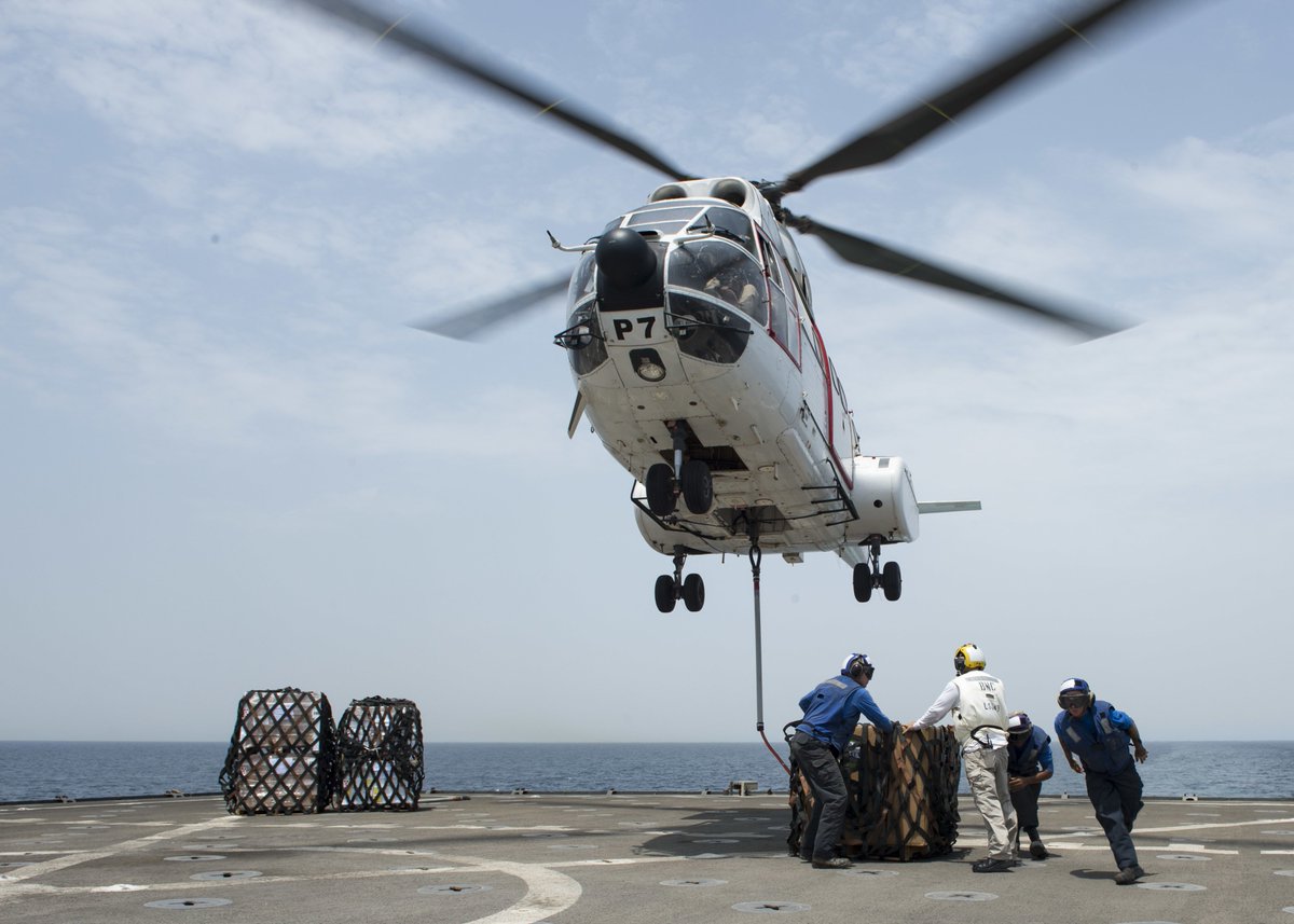 .@USNavy sailors assigned to the amphibious dock landing ship #USSHarpersFerry attach cargo to an SA-330J Puma helicopter assigned to @MSCSealift dry cargo & ammunition ship USNS Cesar Chavez during a vertical replenishment. #KnowYourMil