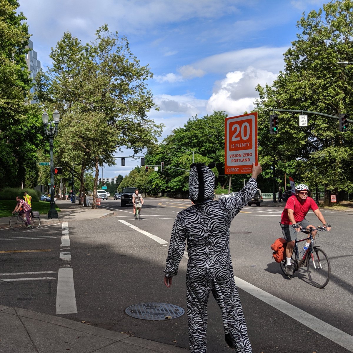 GoLloydPDX's tweet photo. Help us and the Vision Zero Zebra share safety tips for people walking, biking, or driving in the Lloyd neighborhood at next week's #STEPtemberpdx #VisionZero Street Team with @PBOTinfo. Meet at the Streetcar stop at N Broadway and N Ross. Register: https://t.co/CjJNMQSEk0 https://t.co/r9rht57lH0