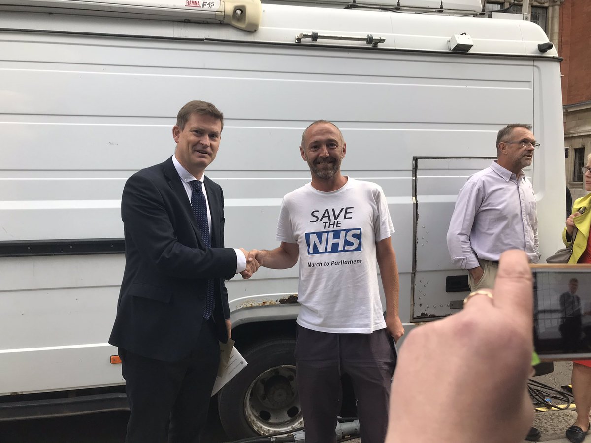 justinmadders's tweet photo. A pleasure to meet James Corbett from Ellesmere Port today who has walked all the way from Glasgow to Parliament to highlight the campaign against privatisation of the NHS and to restore the Secretary of States duty to provide NHS services- a remarkable feat with huge support! https://t.co/hWQJIXR3QR