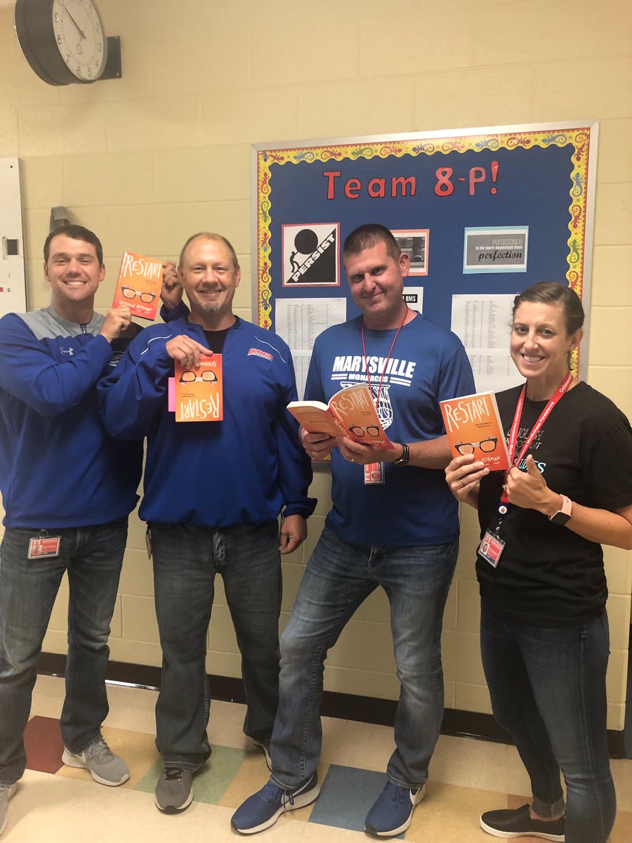BunsoldMS's tweet photo. In celebration of National Read a Book Day, some 8th grade teachers pose with Restart—the novel selected for read aloud during the first 10 minutes of homeroom everyday. Thanks for promoting literacy and empathy, teachers! @MarysvilleEVSD @DianeMankins https://t.co/JReSkIl0Pc