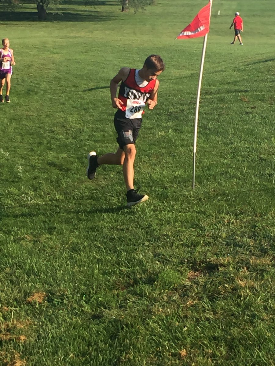 Nathan Rupp rounds a corner early in race at Johnson County. Nathan leads the Yutan junior high boys with a fourth place finish.