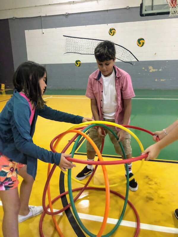 BroadwaterESVA's tweet photo. Lower school students used team building skills to build a Hula Hut in PE class. Levels were added after each challenge. The second level was to send a teammate through. Next, students will work on the third level-blindfold one teammate, build a hut and verbally direct them. https://t.co/x1zrV32Z70
