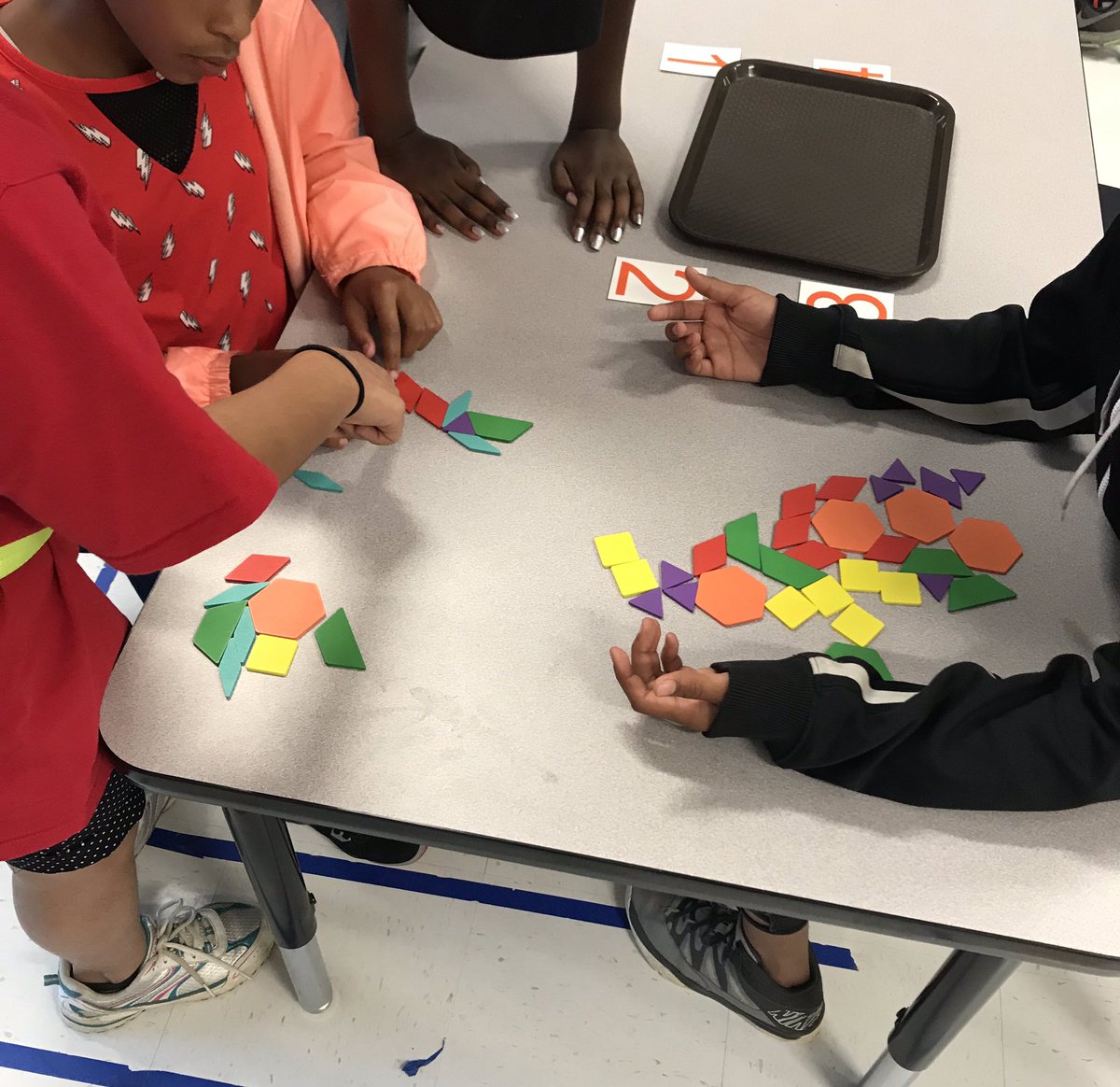 Swaggerty865's tweet photo. Today in STEM, we worked on communication and listening skills. It is tough to look at a hidden tangram or shape puzzle and then go explain to your group how to recreate it without touching it! @InskipE #inskipstem #teamwork #kcs_stem https://t.co/ShPLzB0ApO
