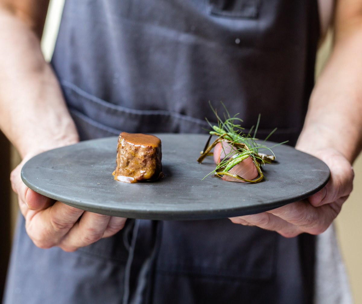 Beef zabuton cooked in fermented butter, charred onions, black olive, pickled torpedo onions, pickled and charred chives, sea beans and fennel fronds