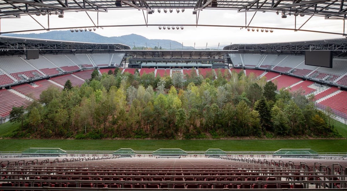 MLSist's tweet image. Breathtaking: Swiss curator Klaus Littmann installed an entire forest, basically, into the home stadium of Austrian side Austria Klagenfurt, who agreed to play elsewhere until the piece is removed in late October. His work was inspired by a 70's illustration, pictured below.