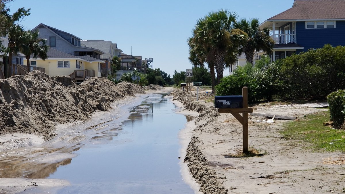 SCDOTPress's tweet photo. SCDOT maintenance forces are removing beach sand from Springs Ave., a state-maintained road, on Pawley's Island on Sept. 6, 2019. (Photos by Rob Thompson/SCDOT) https://t.co/XhoOrL8h2T