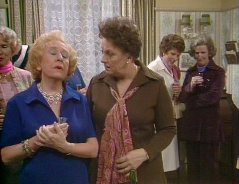 Corriepedia's tweet photo. On this day in 1977: Annie discovers that her prized new monogrammed carpet is a cut-off from a bingo hall immediately before a sherry morning she's holding to show it off https://t.co/dH2R860N4G https://t.co/5cS4jo2vJ0