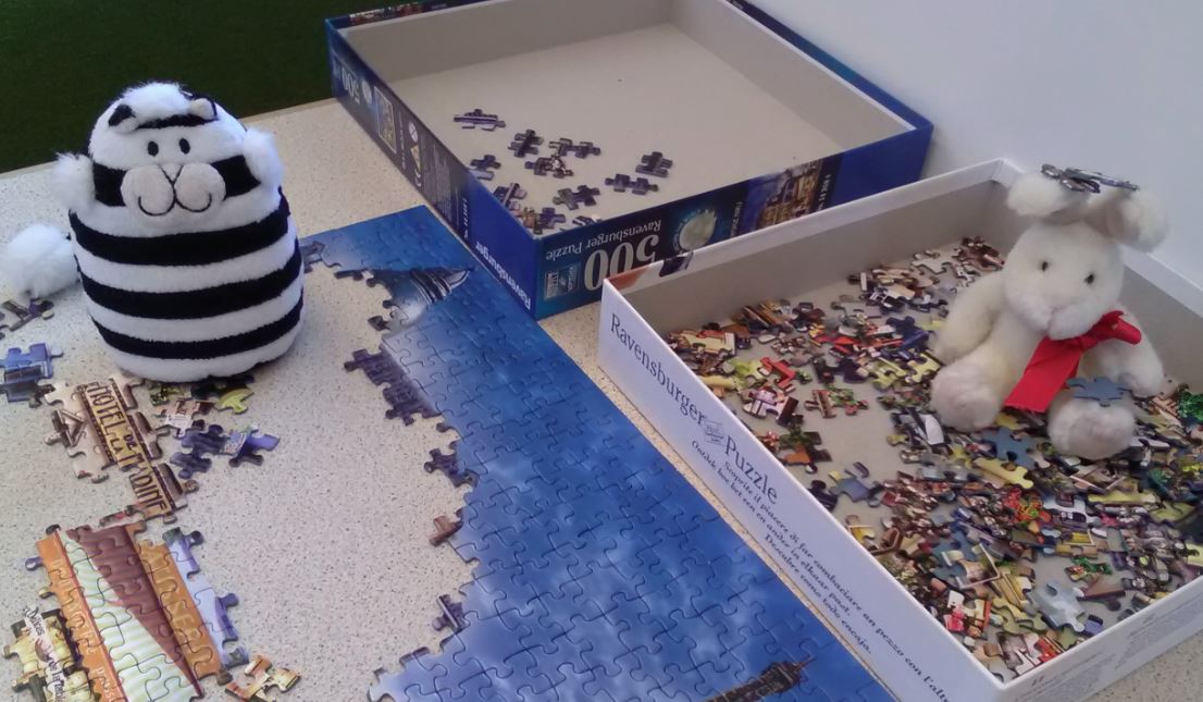 GEHSWFTLibrary's tweet photo. Harvey is loving his time in the Library, so much that he is helping #Billythelibrarycat do the jigsaw! They can stay as long as they like as the Library is open24/7 with a GEH swipe card #teameliot #library https://t.co/5mG3loew1R