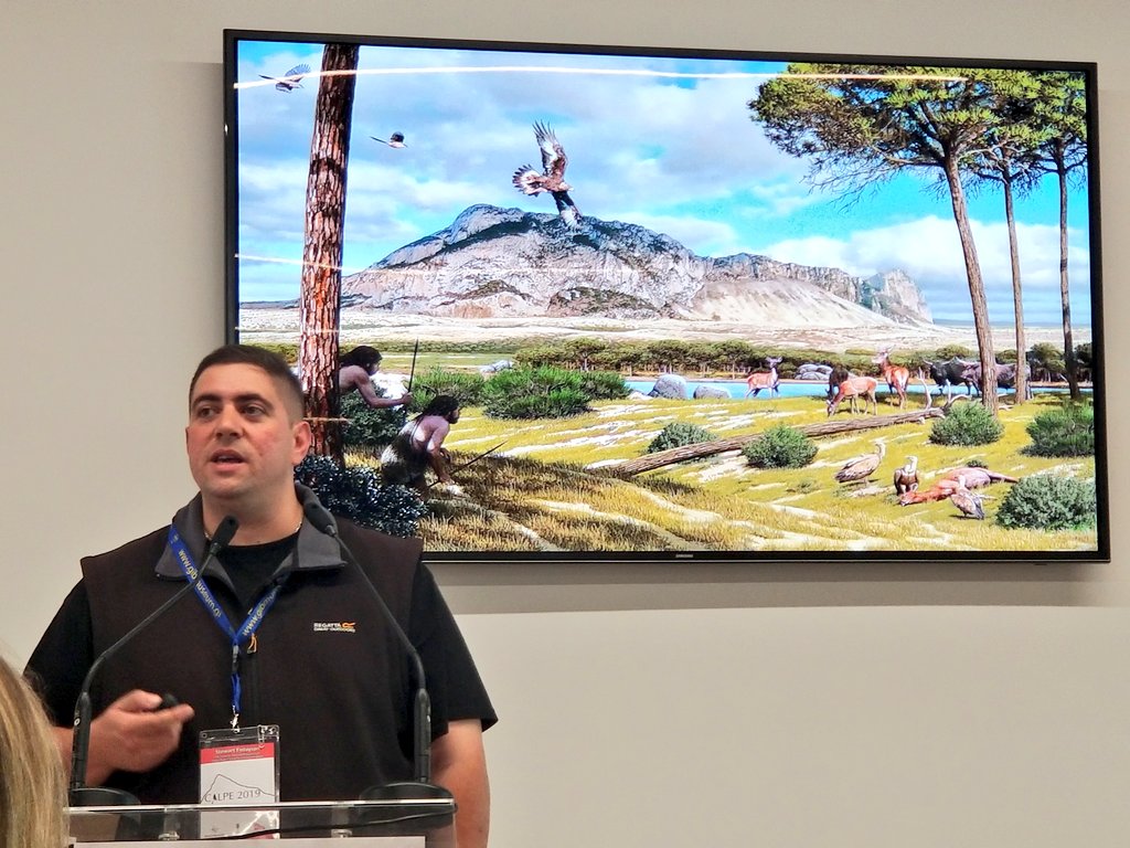 CalpeConference's tweet photo. .@FinlaysonGib tell us about how many of the species we would now consider to be Arctic, were here in #Gibraltar. How the #palaeolandscape has been reconstructed and how these data help us to piece this all together as can be seen in @MAntonPaleoart's reconstructions #Calpe19 https://t.co/6Q7yeLrWtD