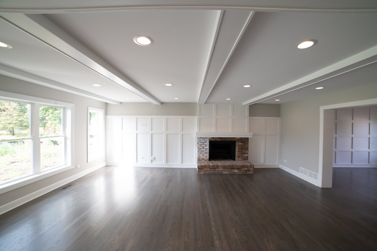 Ceiling beams and wainscot wall along with well placed can lights and open windows that view into a HUGE back yard.  This is a killer room with great potential.  It is part of the great room with the view of the picture coming from the kitchen.  #CustomRemodeling