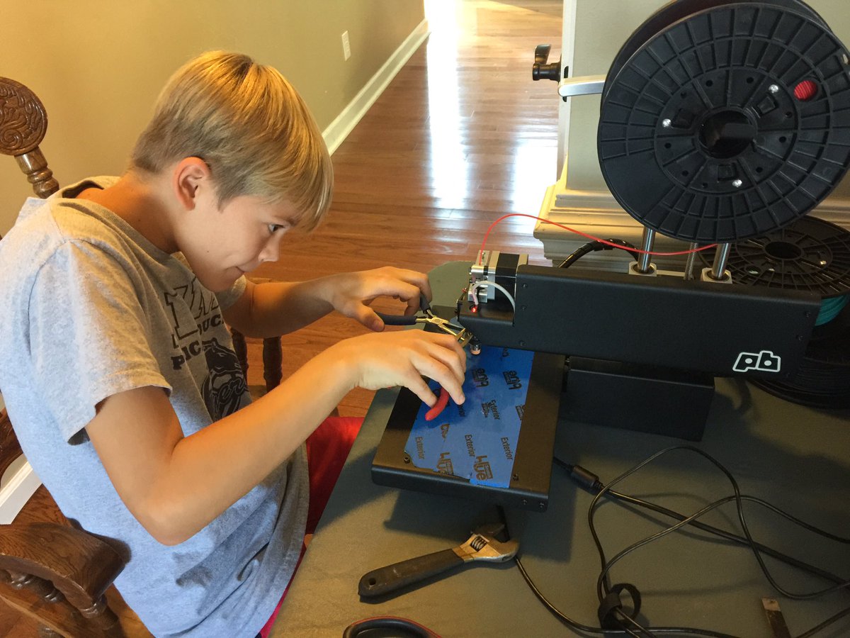 rlnashley's tweet photo. Oldest son adjusting the 3D printer. Finally got 2 pairs of needle nosed pliers! #nccat @afhsmedia #nccatmaker https://t.co/FW6jLnftei