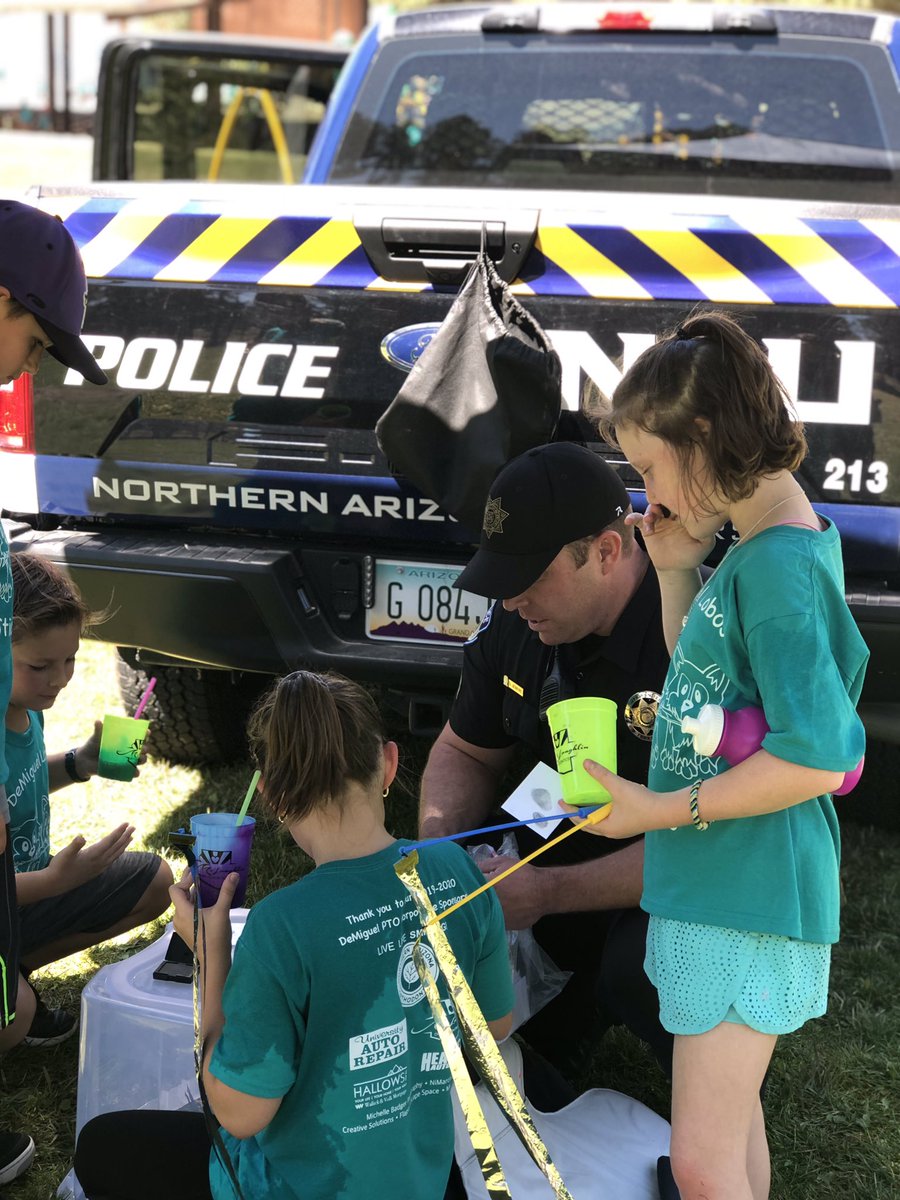 NAUPolice's tweet photo. 🚔NAUPD attended the DeMiguel Dash today! We were able to teach the kids about fingerprints and they got to check out the cars! 🚓 #naupd https://t.co/NWplRv4thY