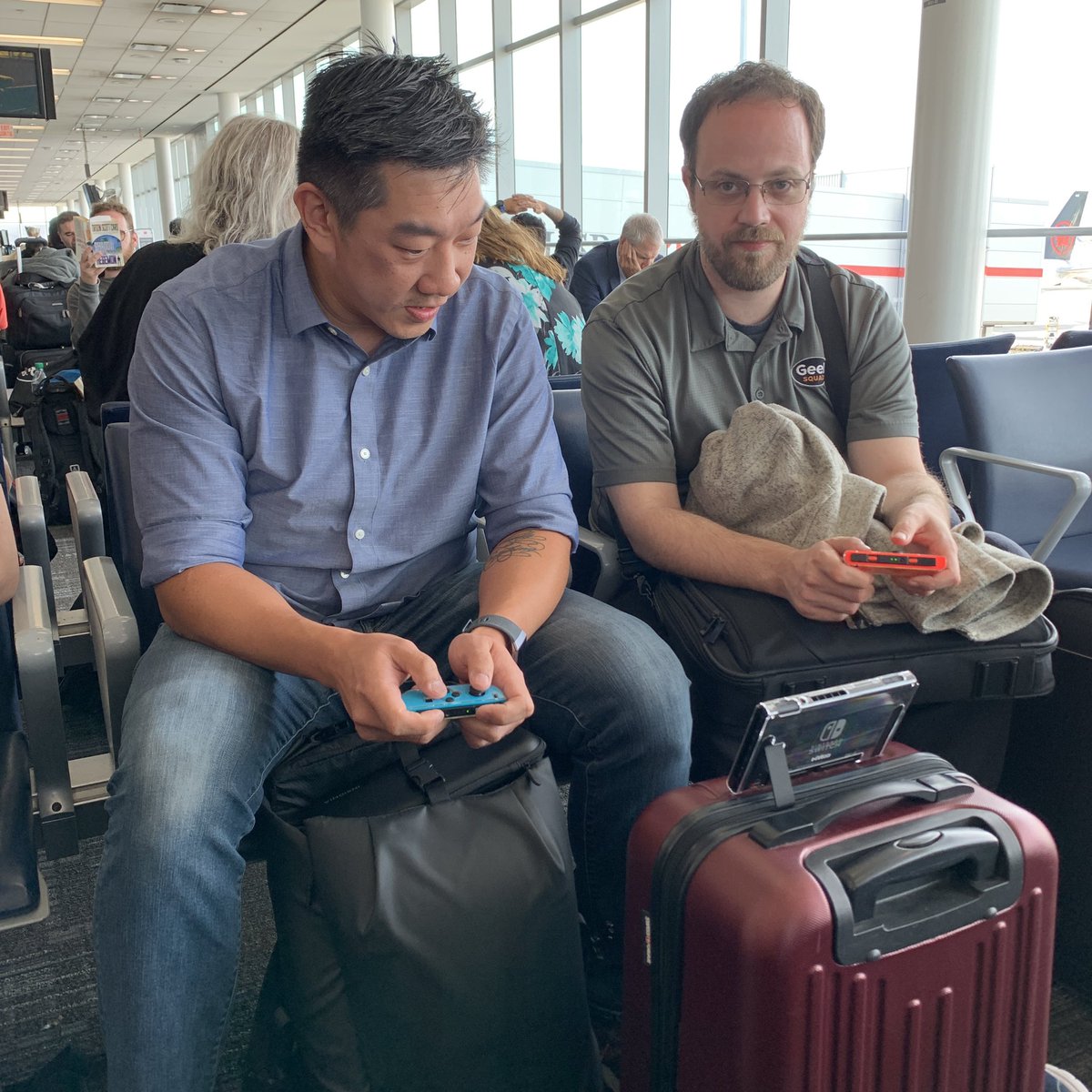 AgentRobins's tweet photo. How Agents pass the time waiting for airplanes. Successful #SquadCon2019 in the books!! https://t.co/4XmwUOoxLa