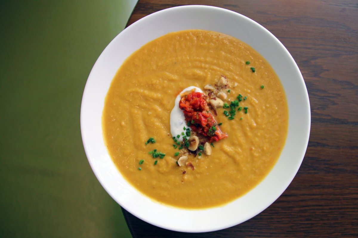 The perfect pairing for these cooler temps: a bowl of our smoked pumpkin soup, topped with toasted hazelnuts and truffled yogurt 🍂